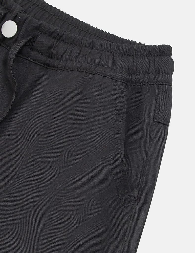 Quần khaki bé gái cạp chun mác dệt thân trước