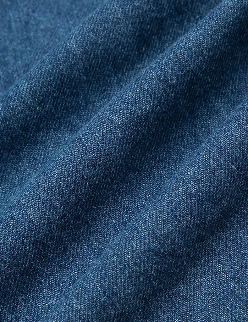 Quần short jean bé gái cạp chun vạt lệch
