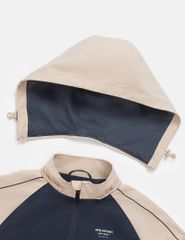 Áo gió có mũ trẻ em phối tay thân in logo trước ngực