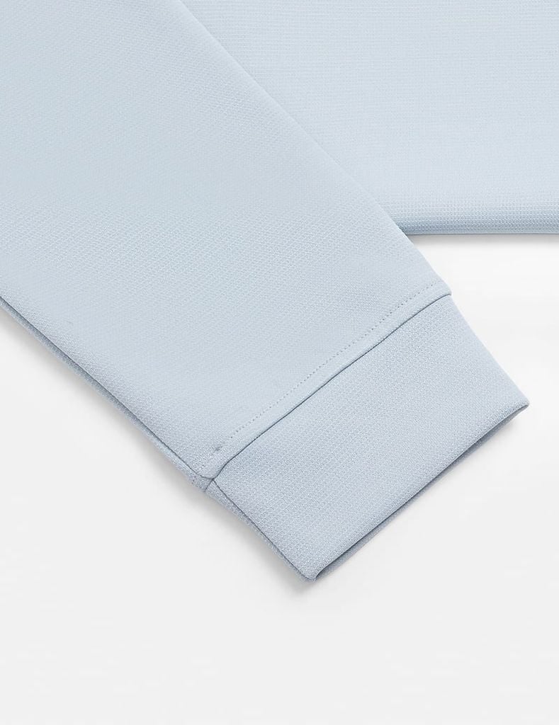 Áo nỉ cổ tròn nam đính mác dệt trên gấu