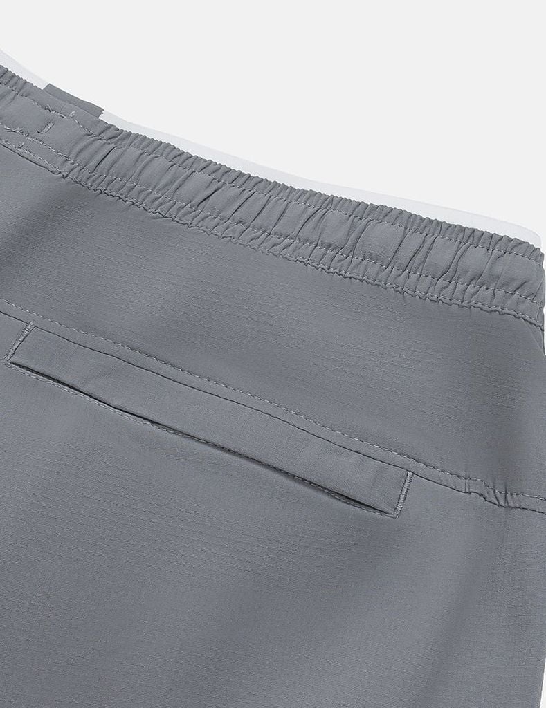 Quần short gió nam cạp chun gấu xẻ