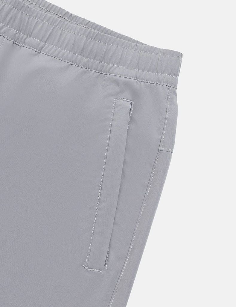 Quần short gió nam cạp chun in ống trái