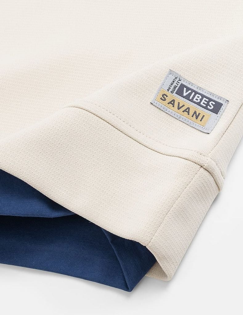 Áo nỉ cổ tròn nữ đính mác dệt trên gấu