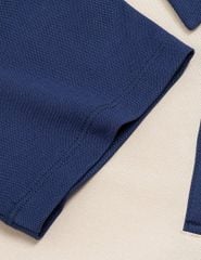Áo polo nữ tay raglang phối ngực in