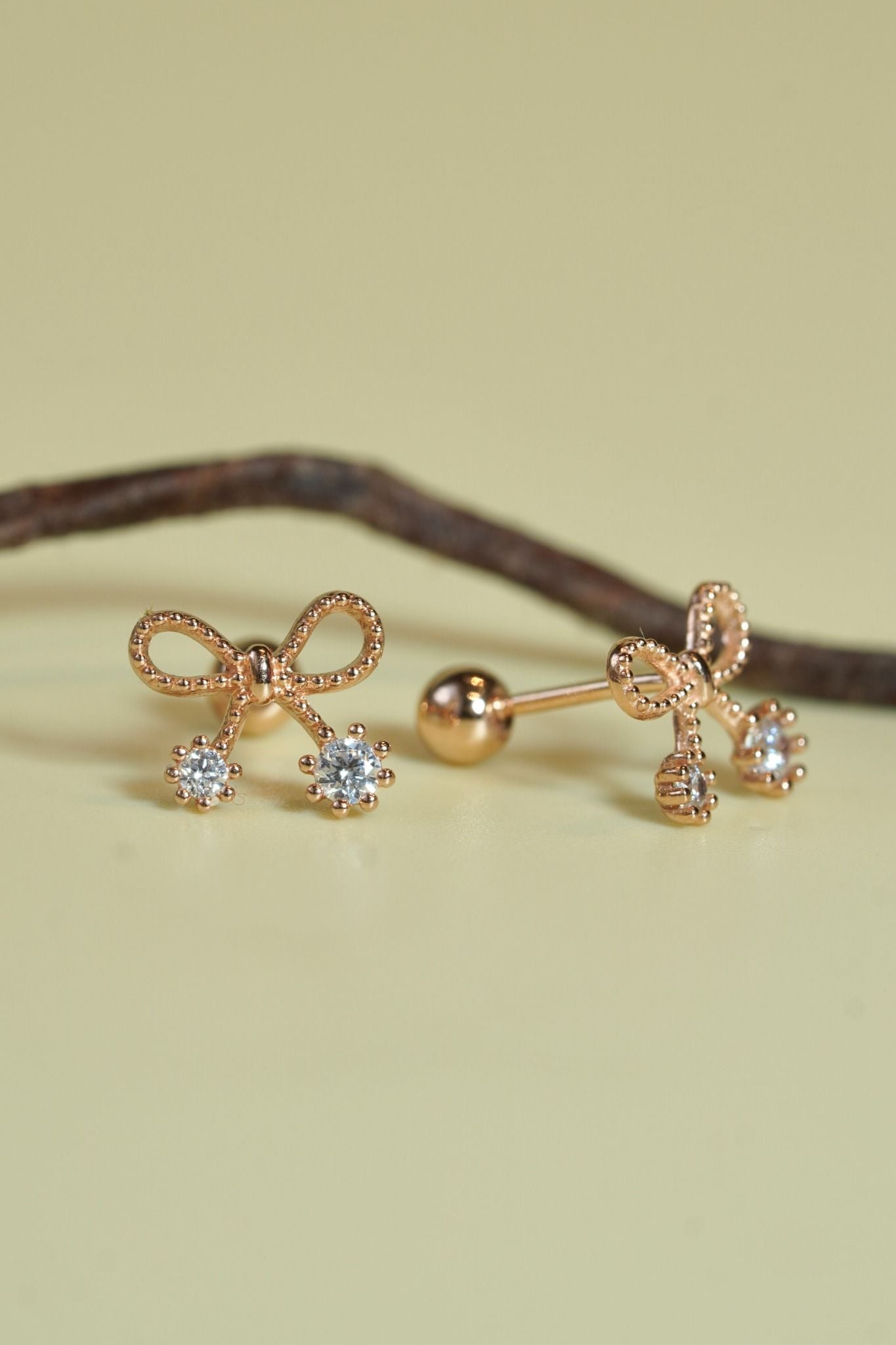 Hoa tai vàng 14k nơ đính đá