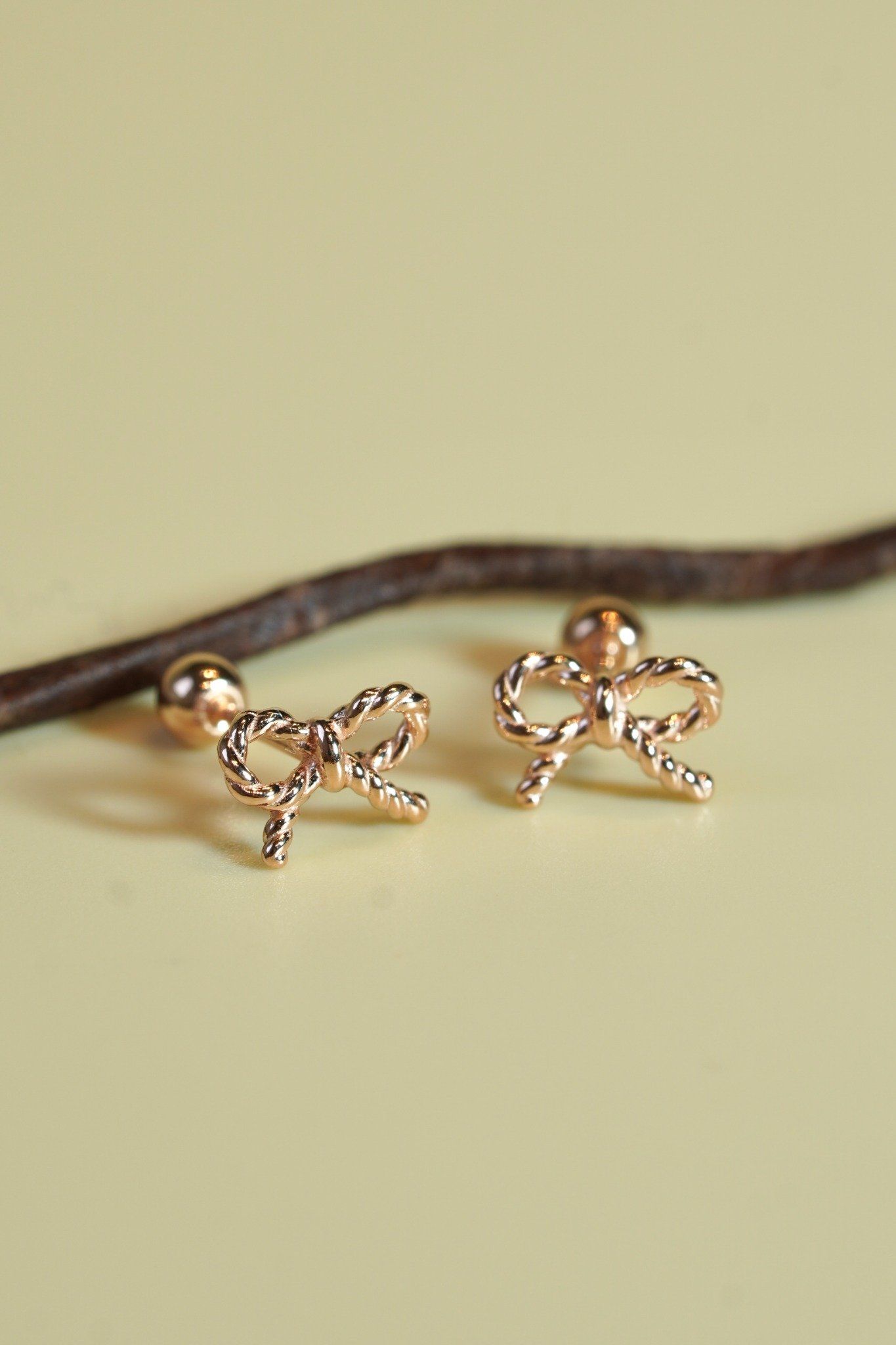 Hoa tai vàng 14k nơ xoắn