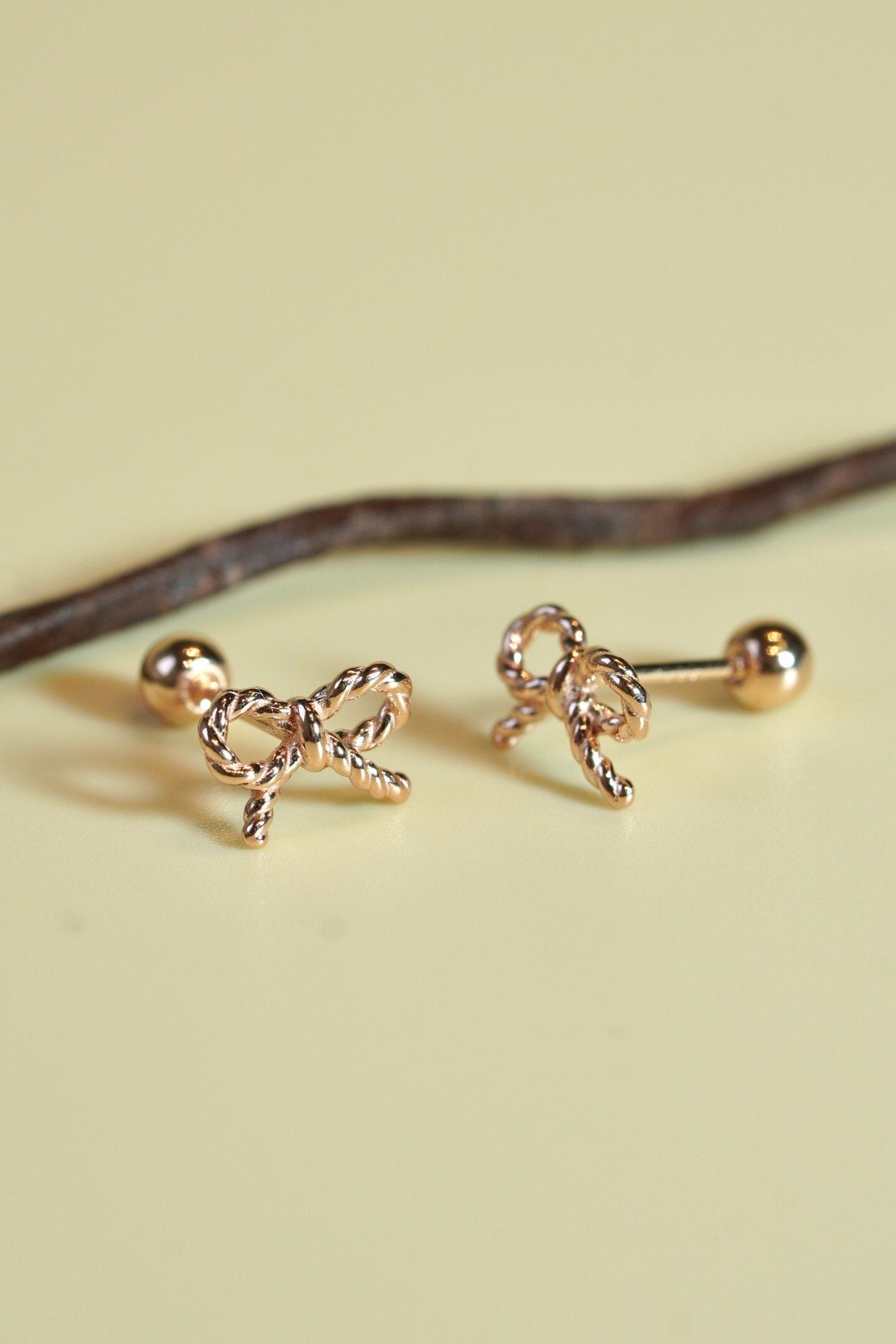 Hoa tai vàng 14k nơ xoắn