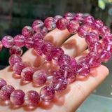  Vòng tay thạch anh Super Seven đỏ hồng “pháo hoa” tự nhiên 100% – dòng tinh thể cao cấp, màu sắc rực rỡ và nổi bật. 