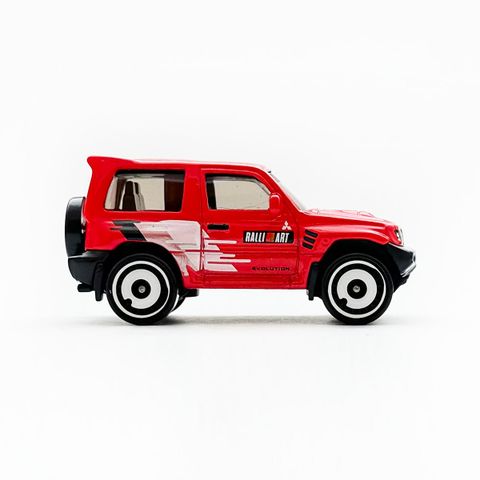  Xe HNK25 Hot Wheels Mitsubishi Pajero Evolution 