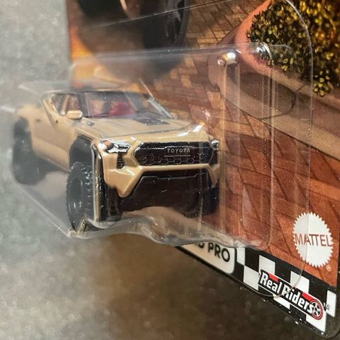  Xe JBL08 Hot Wheels Boulevard 2024 Toyota Tacoma TRD Pro Brown 