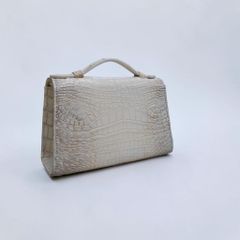 Túi nữ mini cầm tay có dây đeo. Da bụng cá sấu Himalaya!