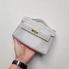 Túi nữ mini cầm tay có dây đeo. Da bụng cá sấu Himalaya!