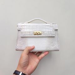 Túi nữ mini cầm tay có dây đeo. Da bụng cá sấu Himalaya!