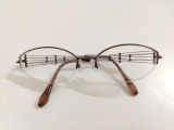  Gọng kính nữ titanium mầu nâu hun khói dáng nửa viền cao cấp thương hiệu Charmant Line Art (XL1006). 