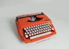 Máy đánh chữ cổ điển nhiều năm tuổi màu cam hiếm gặp Nippo (Made in Japan). 