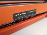  Máy đánh chữ cổ điển nhiều năm tuổi màu cam hiếm gặp Nippo (Made in Japan). 