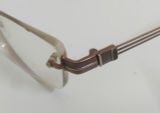  Gọng kính khoan titanium 3 mảnh màu nâu ánh đồng Trichord (Tri04-1222 BR). 