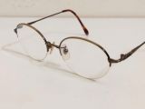  Gọng kính dáng nửa viền cổ điển màu đồng hun khói nhiều năm tuổi Charmant. 