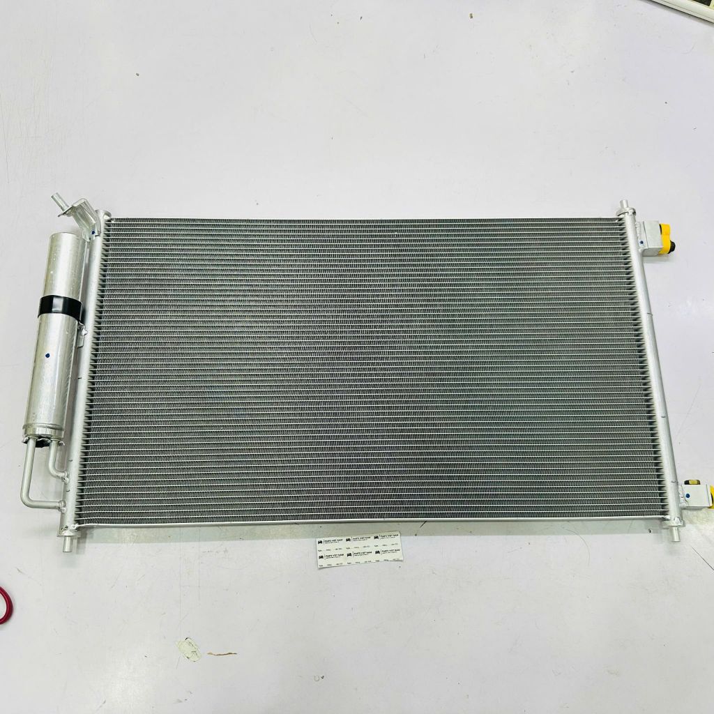Dàn nóng điều hòa (Giàn nóng máy lạnh) Nissan Tiida, Grand Livina, Juke (F15), Micra, Note, Bluebird, Sylphy, Sentra, Renault, Grand. Động cơ 1.6. Đời 2003 - 2019. Hàng China. Mã 92100ED500