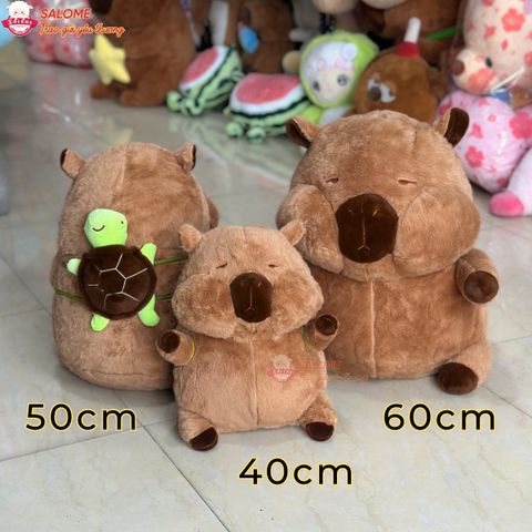  Gấu bông capybara má phính đeo túi con rùa 