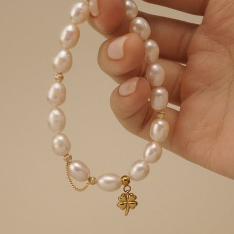 CLOVER LEAF - BOLD RICE SHAPE PEARL MIX ORBIT BRACELET