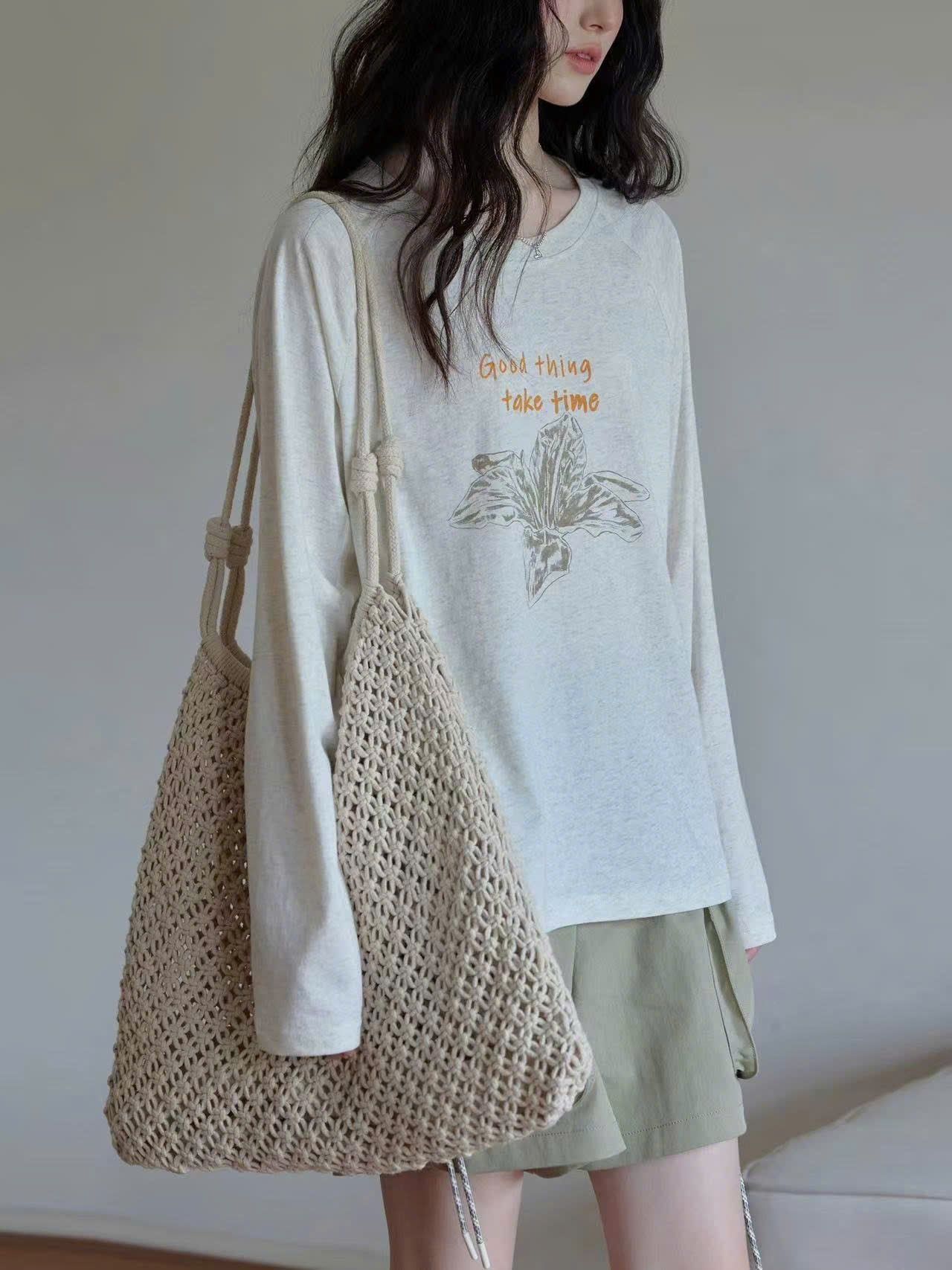  Áo thun tay dài nữ vải xước in chữ 