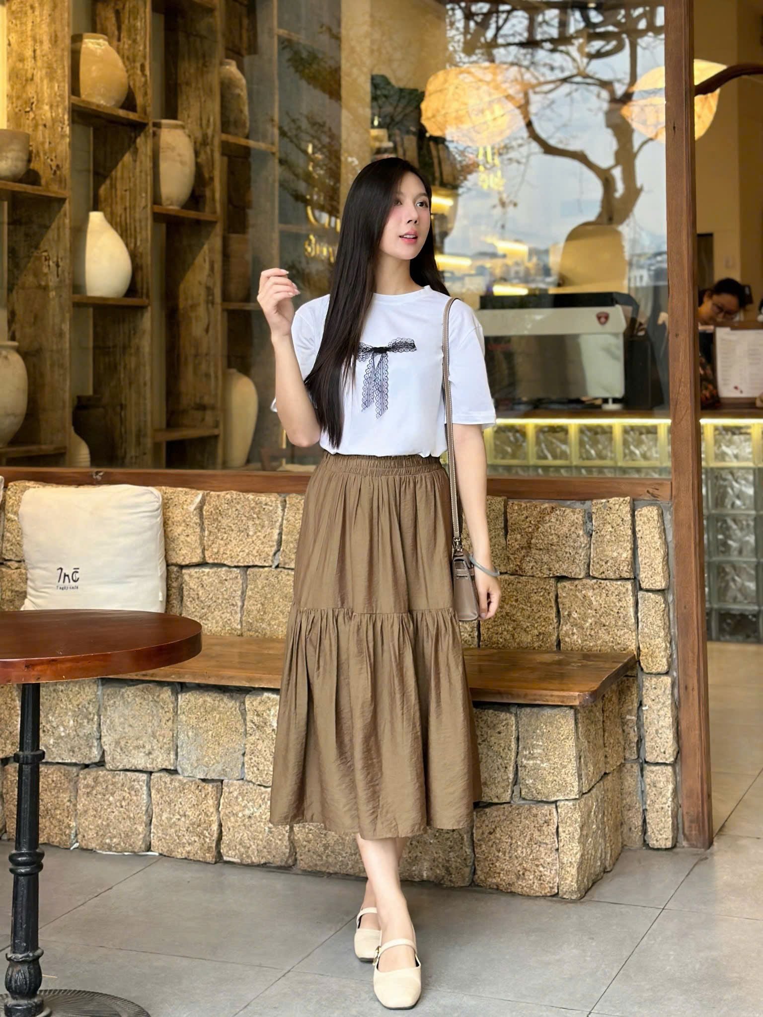  Áo thun hoạ tiết nơ đính nổi nữ 