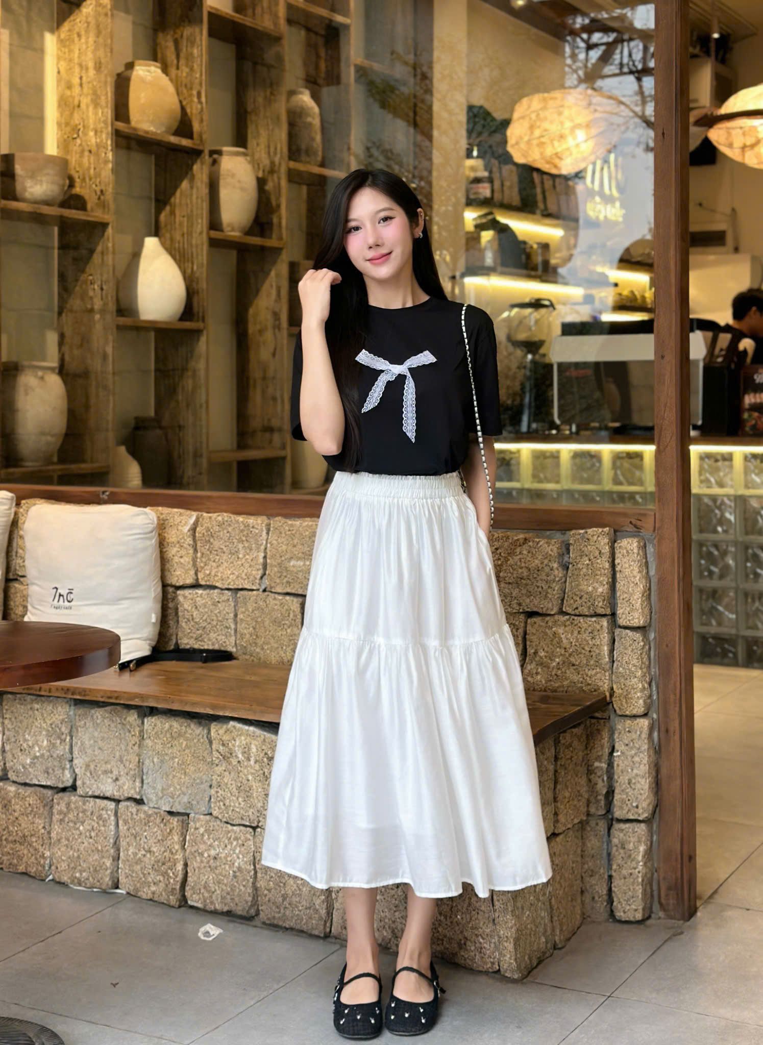  Áo thun hoạ tiết nơ đính nổi nữ 