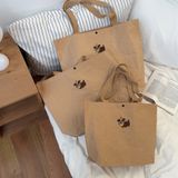  小狗牛皮纸手提包包新款卡通简约大容量托特包出差通勤百搭单肩包 