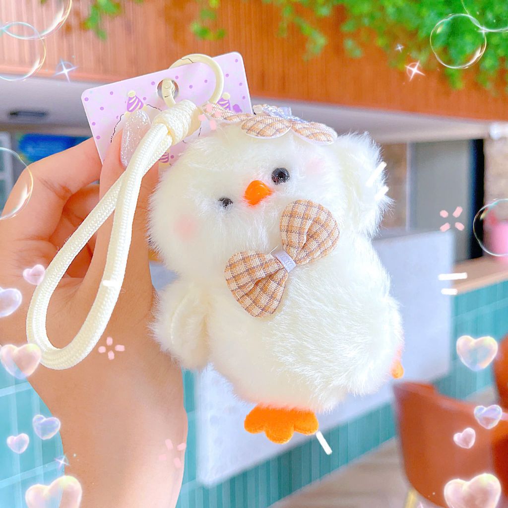 ** Móc khóa bông gà con trắng chân cam đội hoa đeo nơ dây thừng