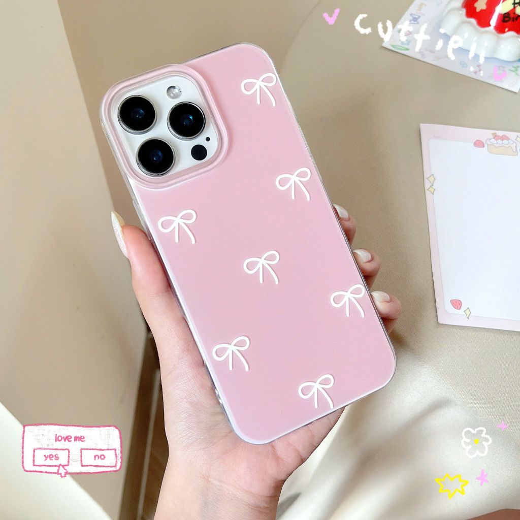 ** Ốp iPhone 16 Pro lưng cứng hồng cam trơn nơ trắng