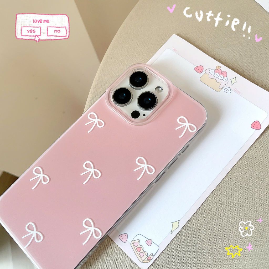 ** Ốp iPhone 16 Pro lưng cứng hồng cam trơn nơ trắng