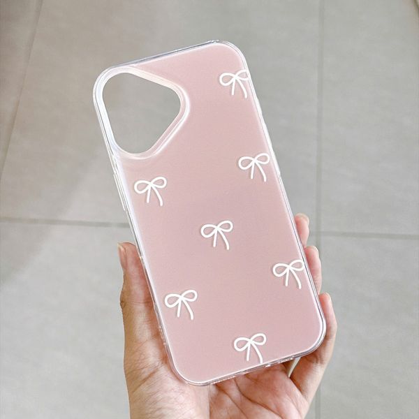 ** Ốp iPhone 17 lưng cứng hồng cam nơ trắng