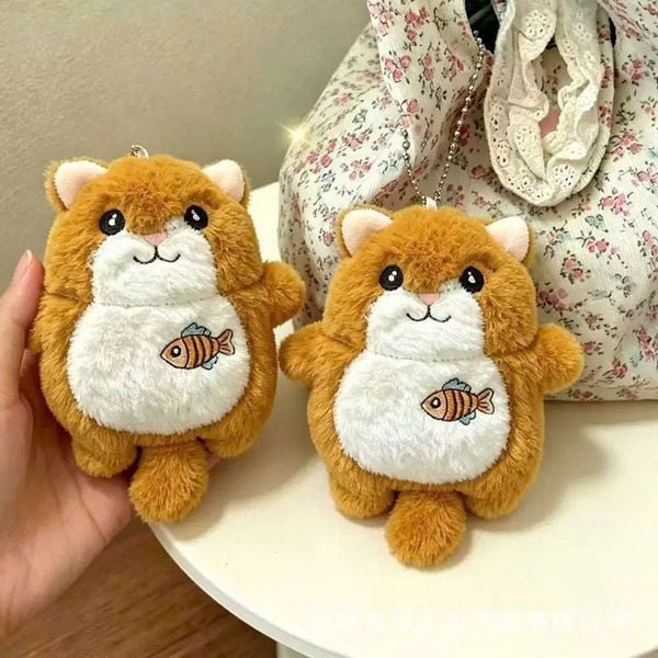 ** Móc khóa bông rái cá cam bóp kêu
