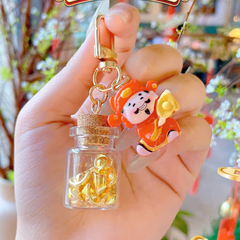 ** Móc khóa thần tài và hủ vàng