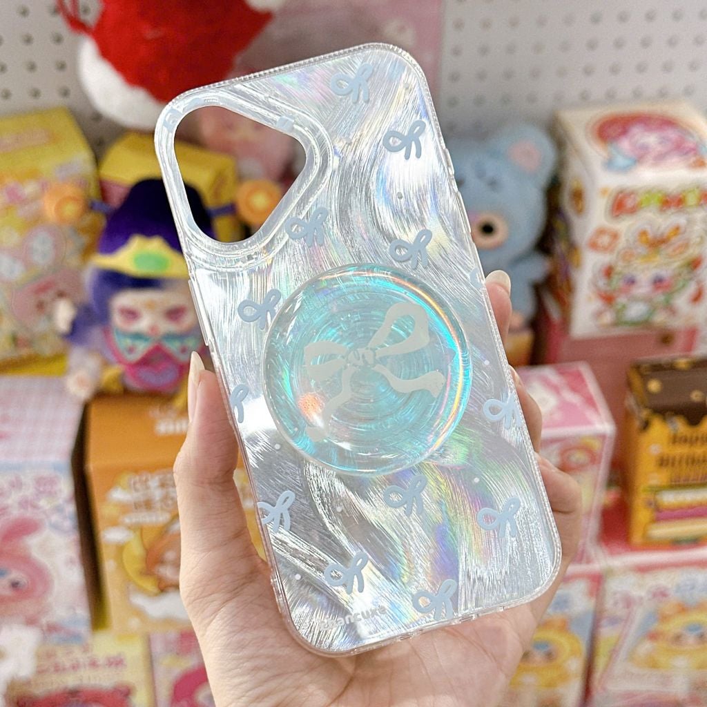 ** Ốp iPhone 17 vân sóng ánh bạc nơ xanh kèm pop