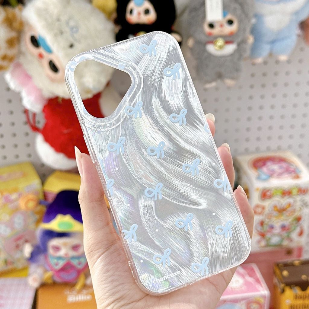 ** Ốp iPhone 17 vân sóng ánh bạc nơ xanh kèm pop