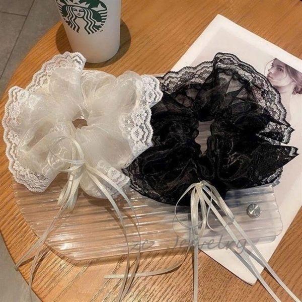 ** Scrunchies ren trắng/đen có nơ nhỏ xinh