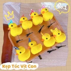 ** Kẹp tóc lò xo vịt vàng đội nơ
