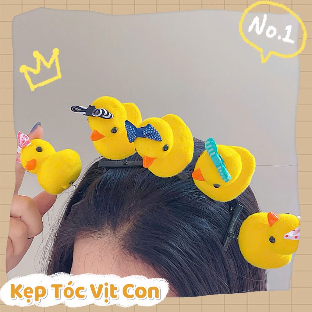** Kẹp tóc lò xo vịt vàng đội nơ