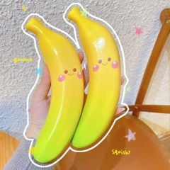 ** Squishy trái chuối mặt cười