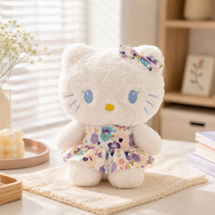 ** GẤU BÔNG KITTY ĐÍNH NƠ MẶC VÁY HOA SIZE 25CM