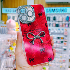 Ốp IP 15 Pro Max vân đá nền đỏ đính nơ bạc