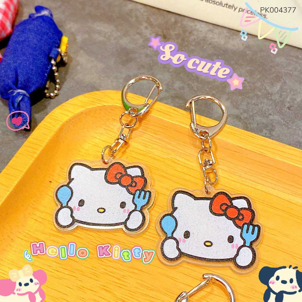 ** Móc khóa mica in Kitty nơ đỏ cầm nĩa xanh