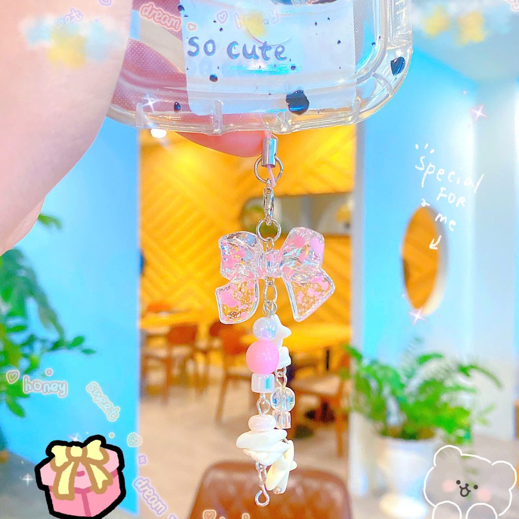 ** Móc khóa nơ hồng vò sò