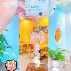 ** Móc khóa nơ hồng vò sò