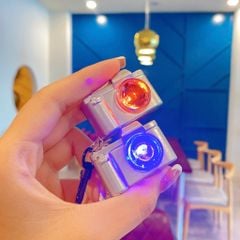 ** Móc khóa súng/máy ảnh bật đèn
