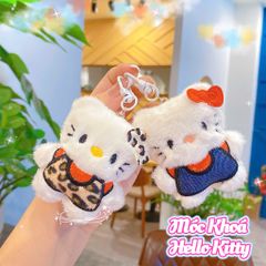 ** Móc khóa bông Kitty mặc áo xanh/beo