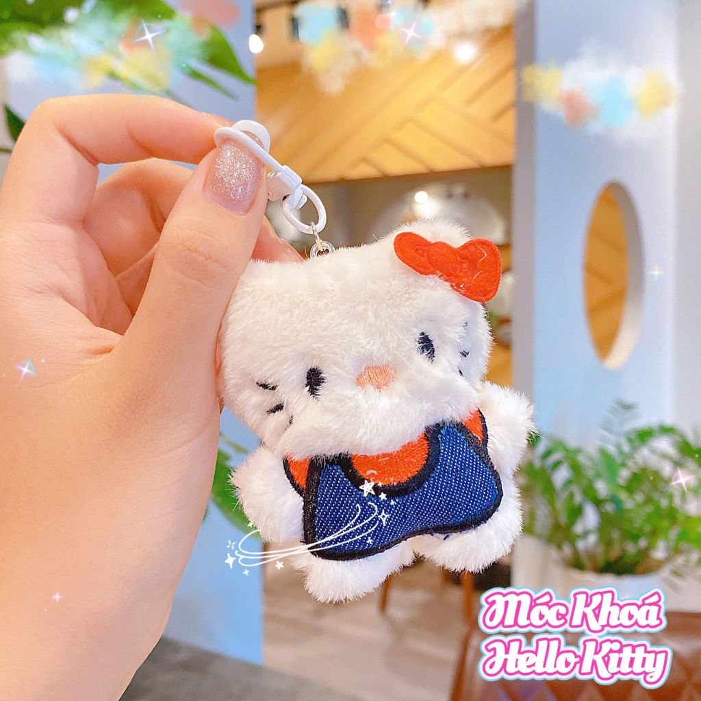 ** Móc khóa bông Kitty mặc áo xanh/beo