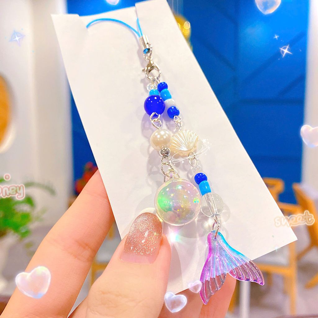 ** Dây đeo điện thoại chuỗi đuôi cá ánh tím